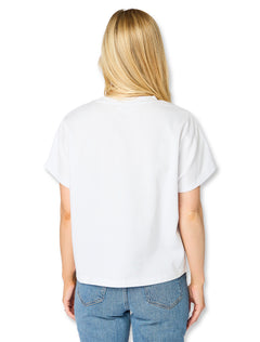 Detail of the raised chenille lettering on the white Stewart Simmons Texas Tech boxy top
