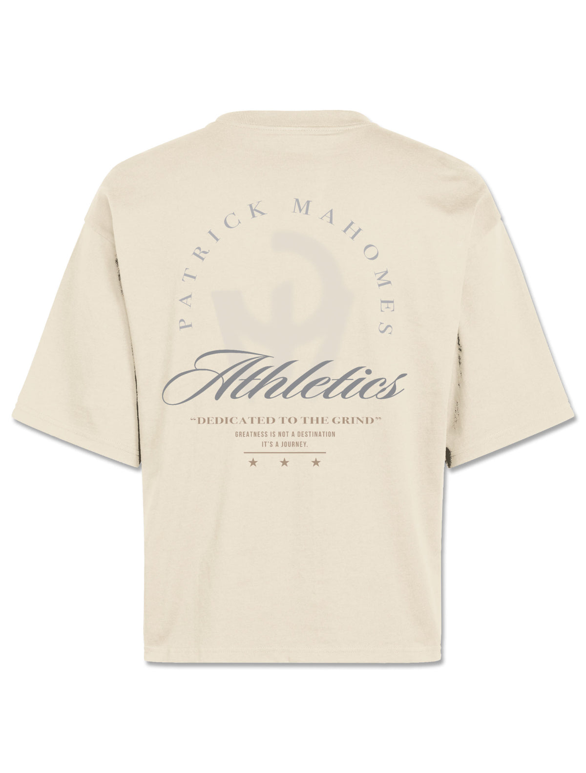 Back of the ivory boxy tee with PATRICK MAHOMES arched over Athletics script and Dedicated to the Grind