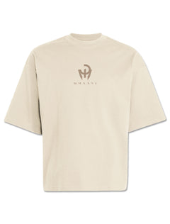 Front of an ivory Adidas boxy tee with a tonal taupe Mahomes monogram over MMXXVI