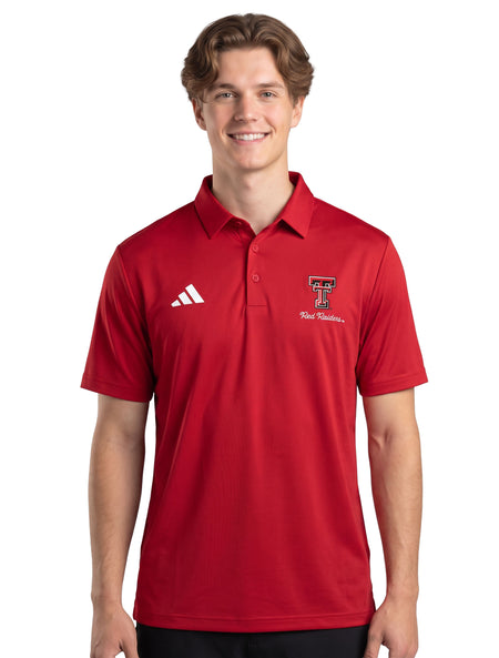 Model wearing the red Adidas Texas Tech polo, front view showing the self fabric collar, the three button placket, and the chest lockup