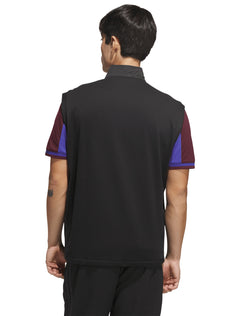 Back of the black golf vest showing the soft knit back panel