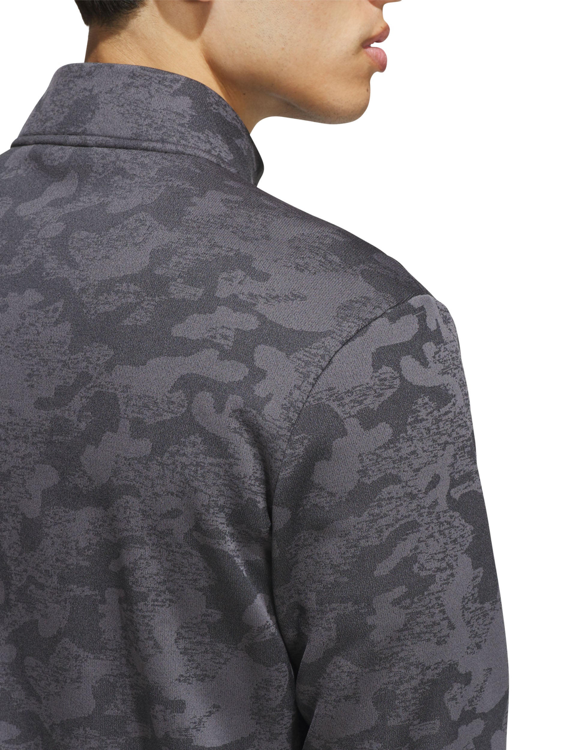 Close-up of the grey and black camo jacquard knit at the collar and shoulder