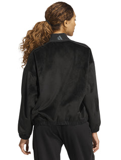Model wearing the black Adidas women's velvet bomber jacket, back view with a grey Adidas logo at the back neck