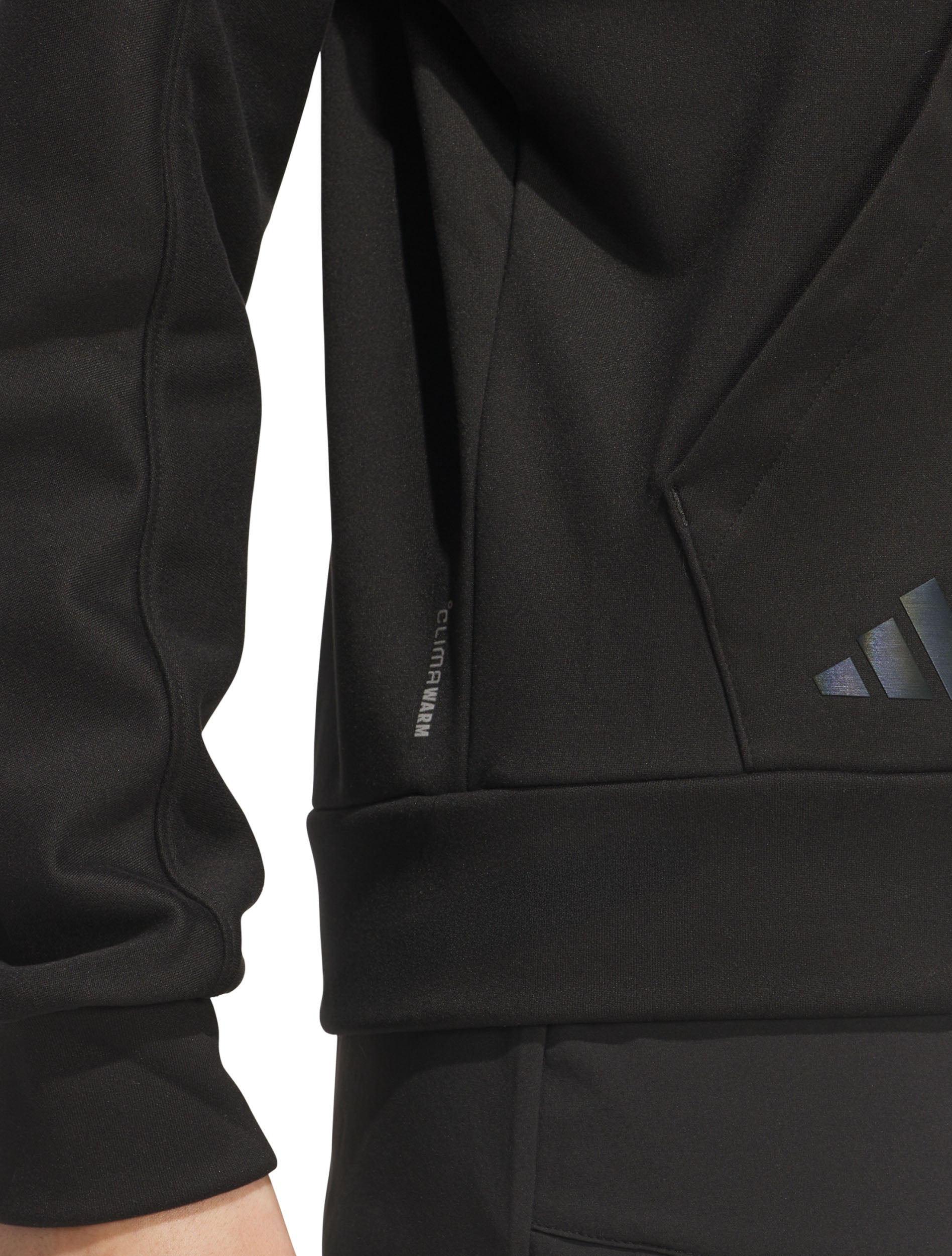 Close-up detail of the black Adidas women's golf hoodie