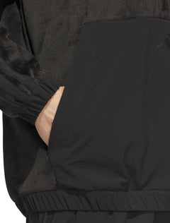 Close-up of the woven front panel and kangaroo pocket on the black plush golf hood