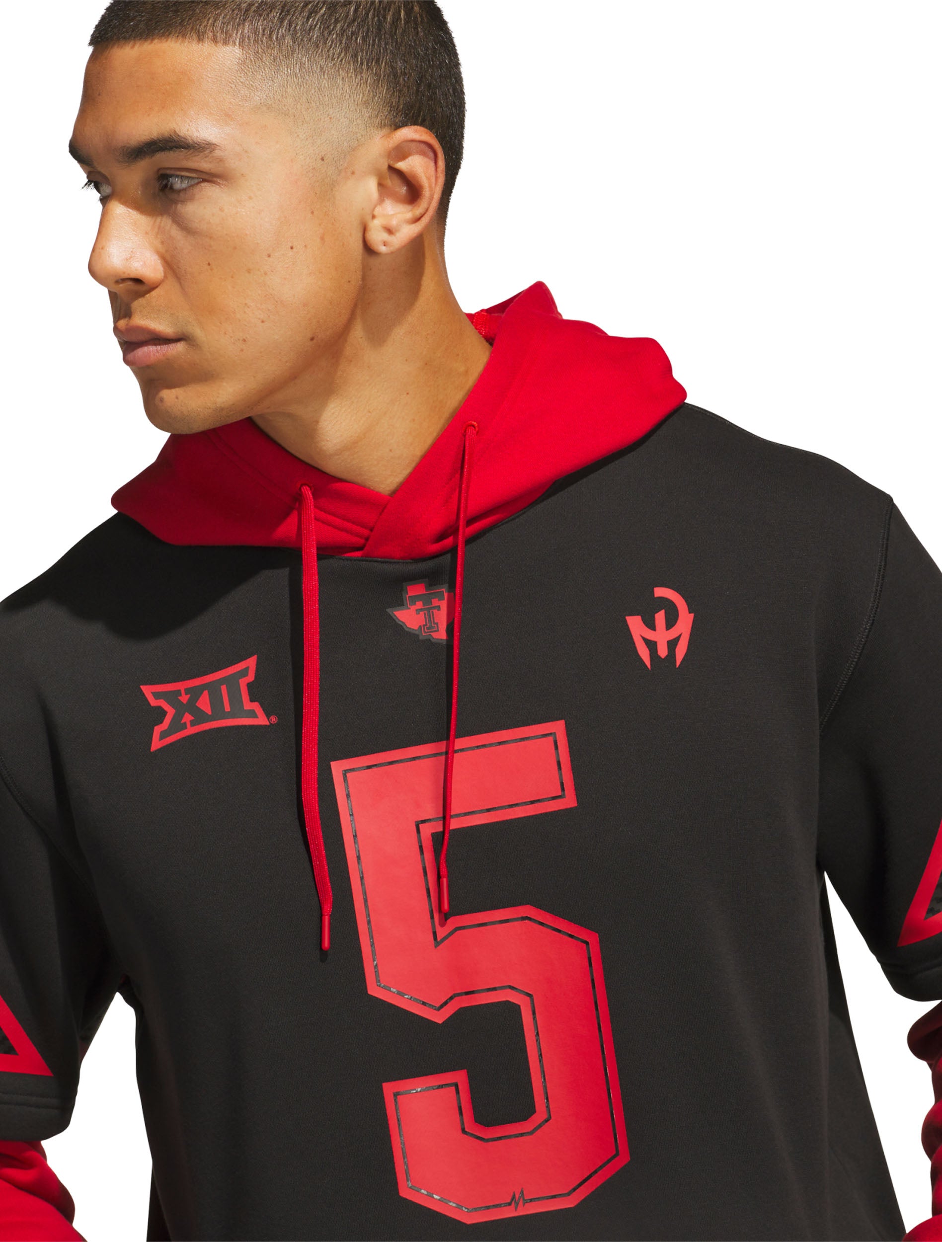 Model wearing the black Texas Tech hooded jersey, close view of the red hood, the number 5 and the chest marks