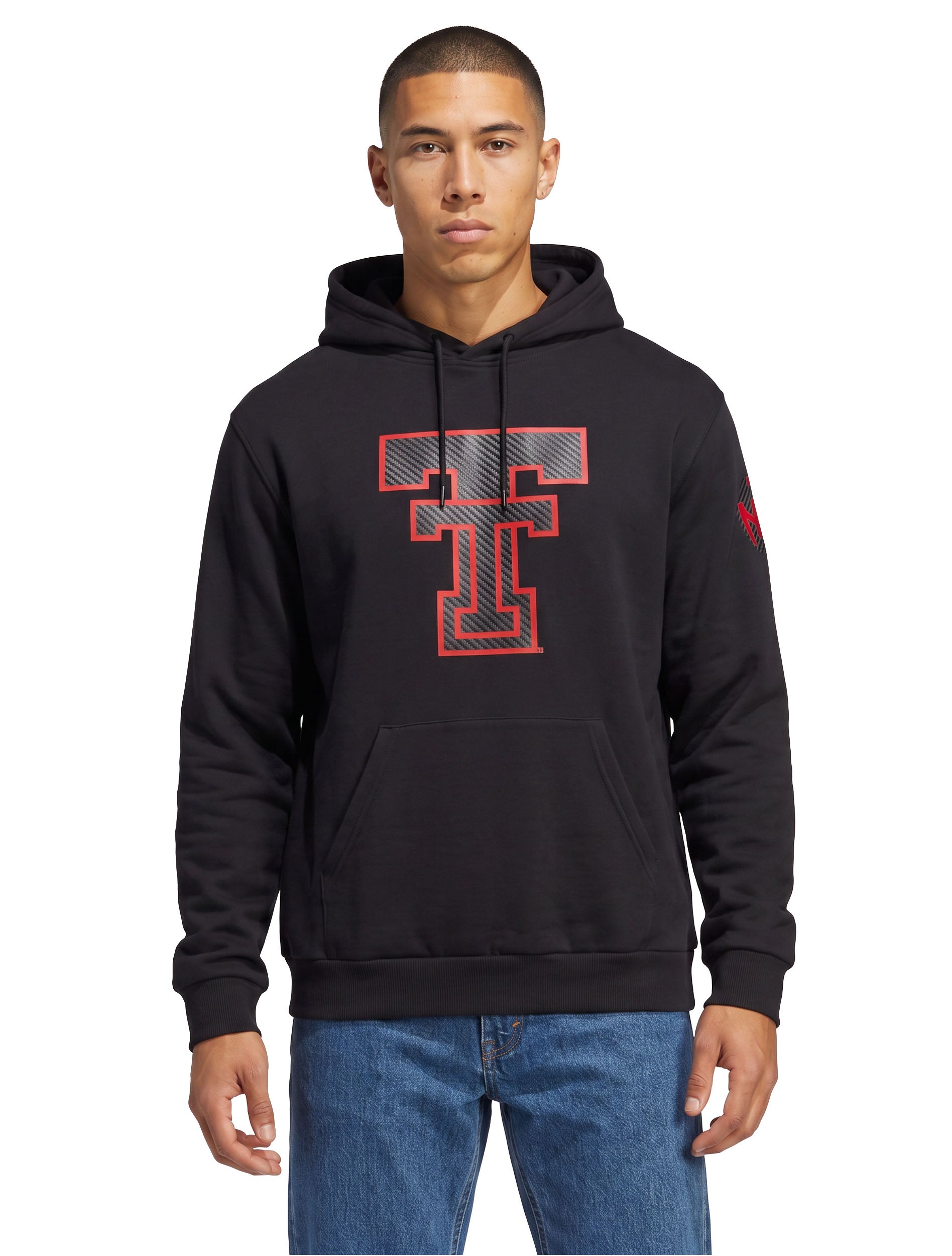 Model wearing the black Texas Tech hoodie with the large carbon Double T at the chest, styled with denim