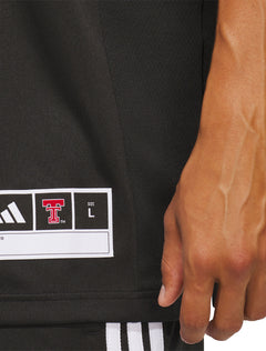 Full length view of a model wearing the black Texas Tech Mahomes jersey with black shorts