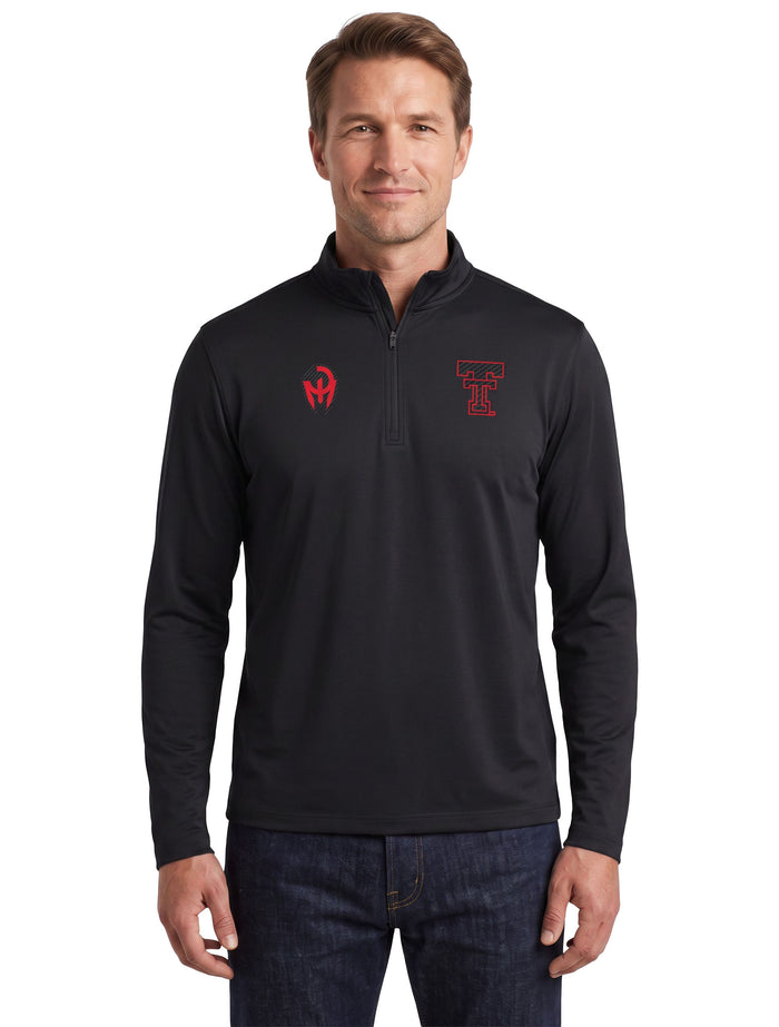Model wearing the black Texas Tech long sleeve quarter zip, front view with the Mahomes Gladiator logo and Double T at the chest
