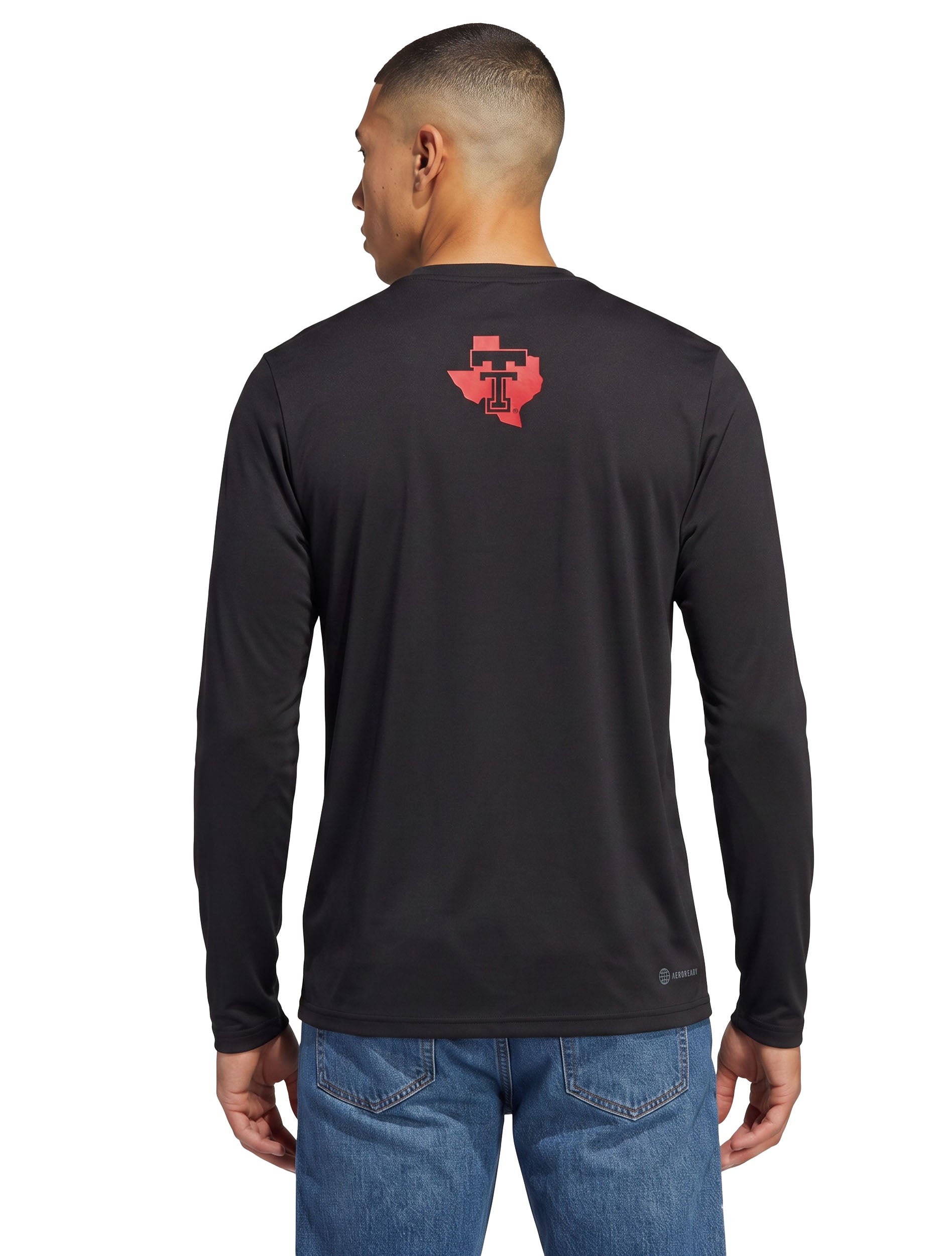 Model seen from behind in the black Texas Tech long sleeve t-shirt, showing the Lone Star Pride logo in red below the collar