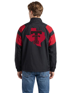 Model seen from behind in the black Texas Tech track jacket, showing the Lone Star Pride logo in red across the shoulders