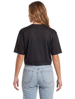 Model wearing the black Texas Tech mesh crop jersey, back view showing the plain back and the adidas elastic hem band
