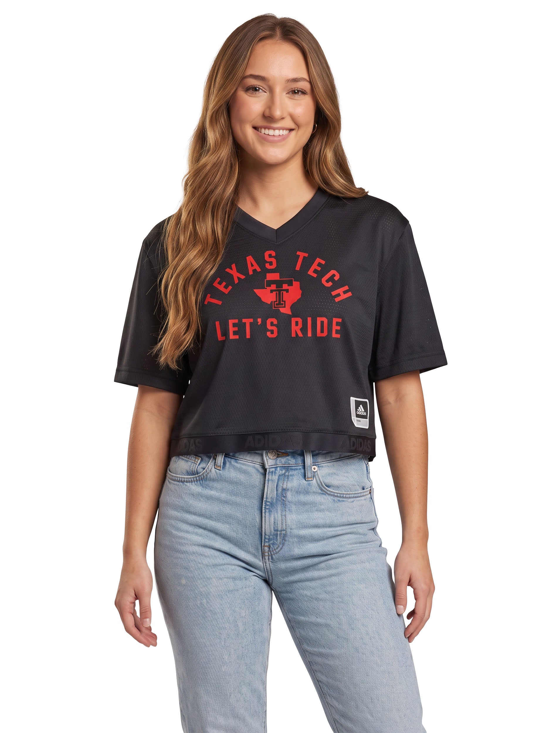 Model wearing the black Texas Tech mesh crop jersey, front view with TEXAS TECH arched in red above the Lone Star Pride logo