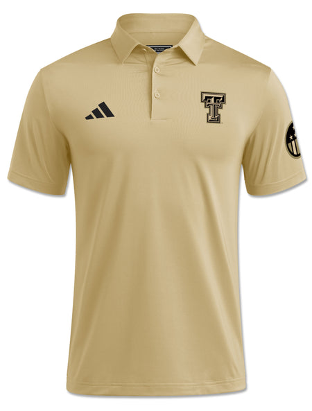 Front view of a black Double T and Honor & Support sleeve roundel on a tan Adidas Texas Tech Ultimate365 polo