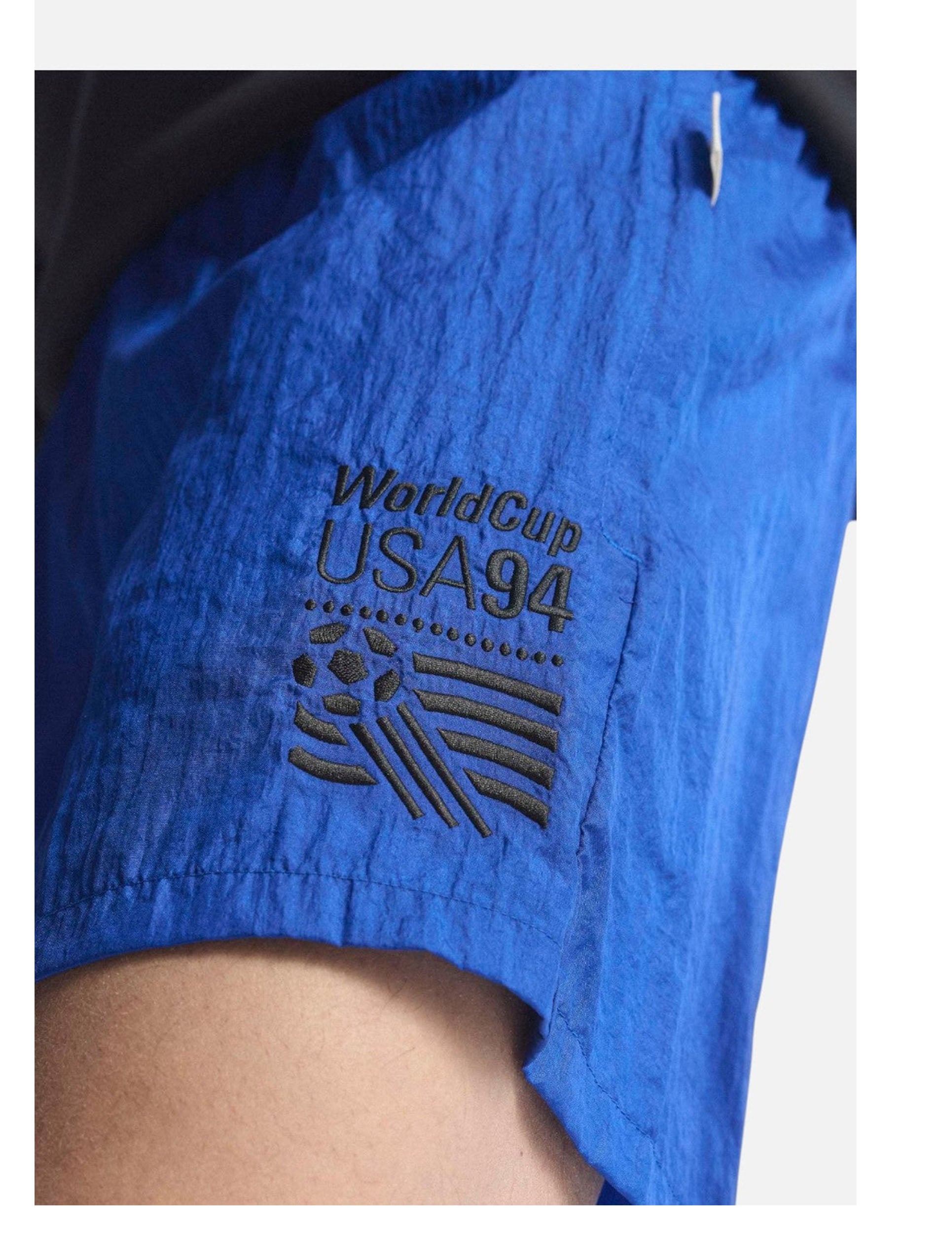 Adidas USA 94 Graphic Shorts in Royal Blue — back view