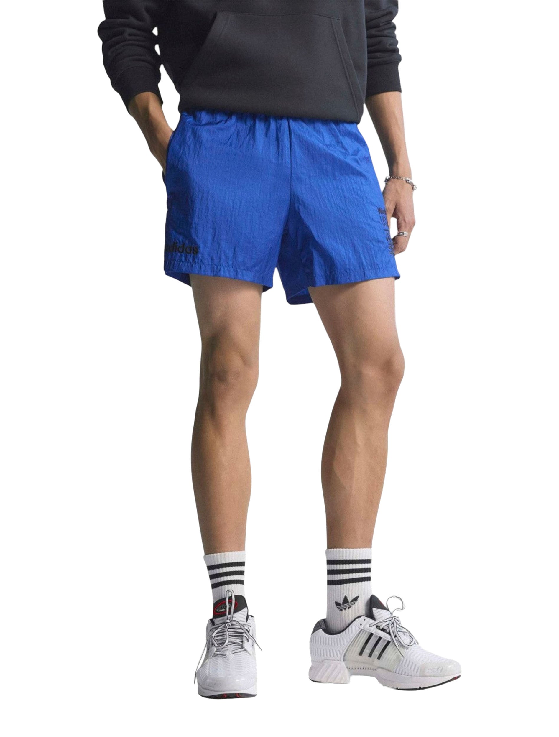 Adidas USA 94 Graphic Shorts in Royal Blue worn by model — front