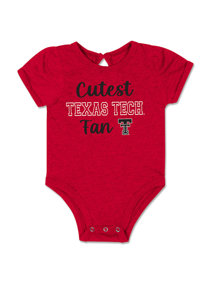 Heather red Texas Tech infant onesie reading Cutest in black script above TEXAS TECH in white outlined letters, with Fan and the Double T beneath