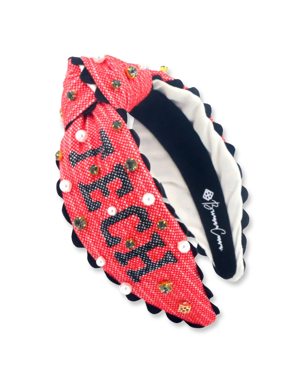 Second view of the red Texas Tech cross stitch headband showing the “Tech” lettering and scalloped black trim