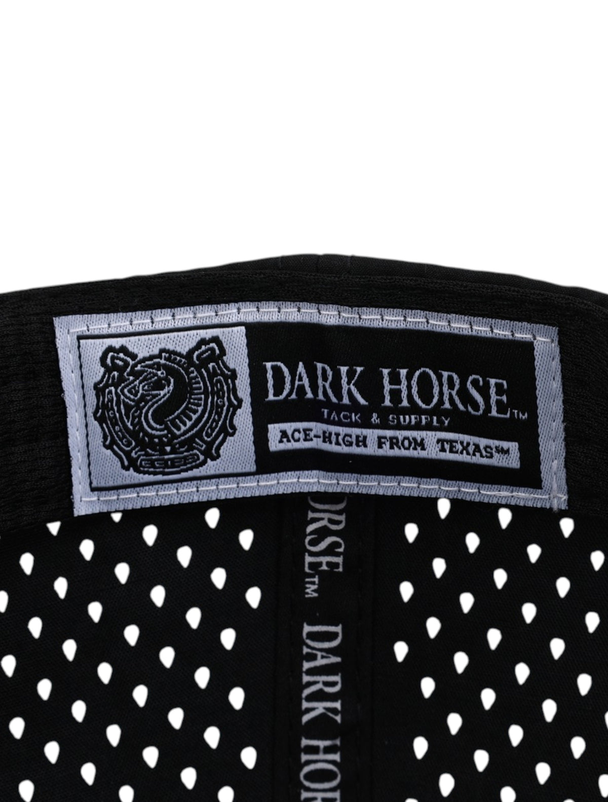 Inside detail of the Texas Tech 806 black rope cap showing the Dark Horse Tack and Supply woven label