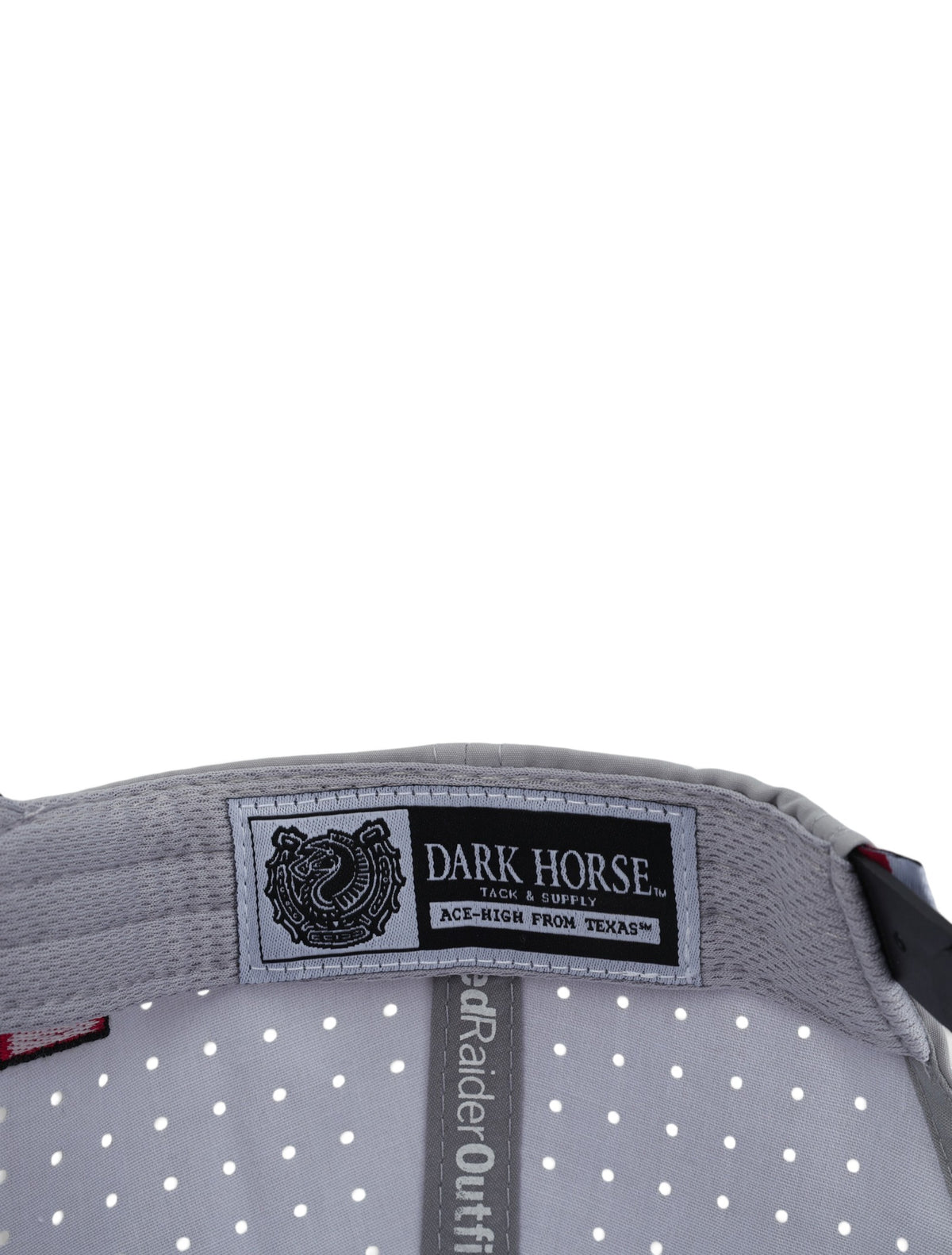 Inside the grey Texas Tech cap showing the Dark Horse Tack and Supply label on the sweatband