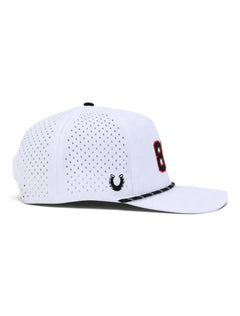 Side view of the Texas Tech 806 white rope cap showing the Dark Horse horseshoe and the laser cut perforated panels