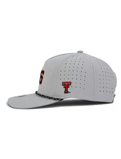 Side of the grey Texas Tech youth cap showing the embroidered Double T and the laser cut perforations