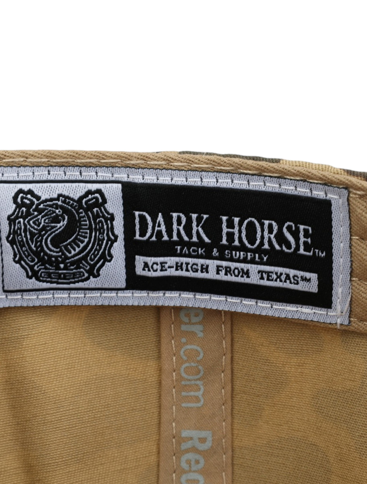 Inside the camo Texas Tech cap showing the Dark Horse Tack and Supply label on the sweatband