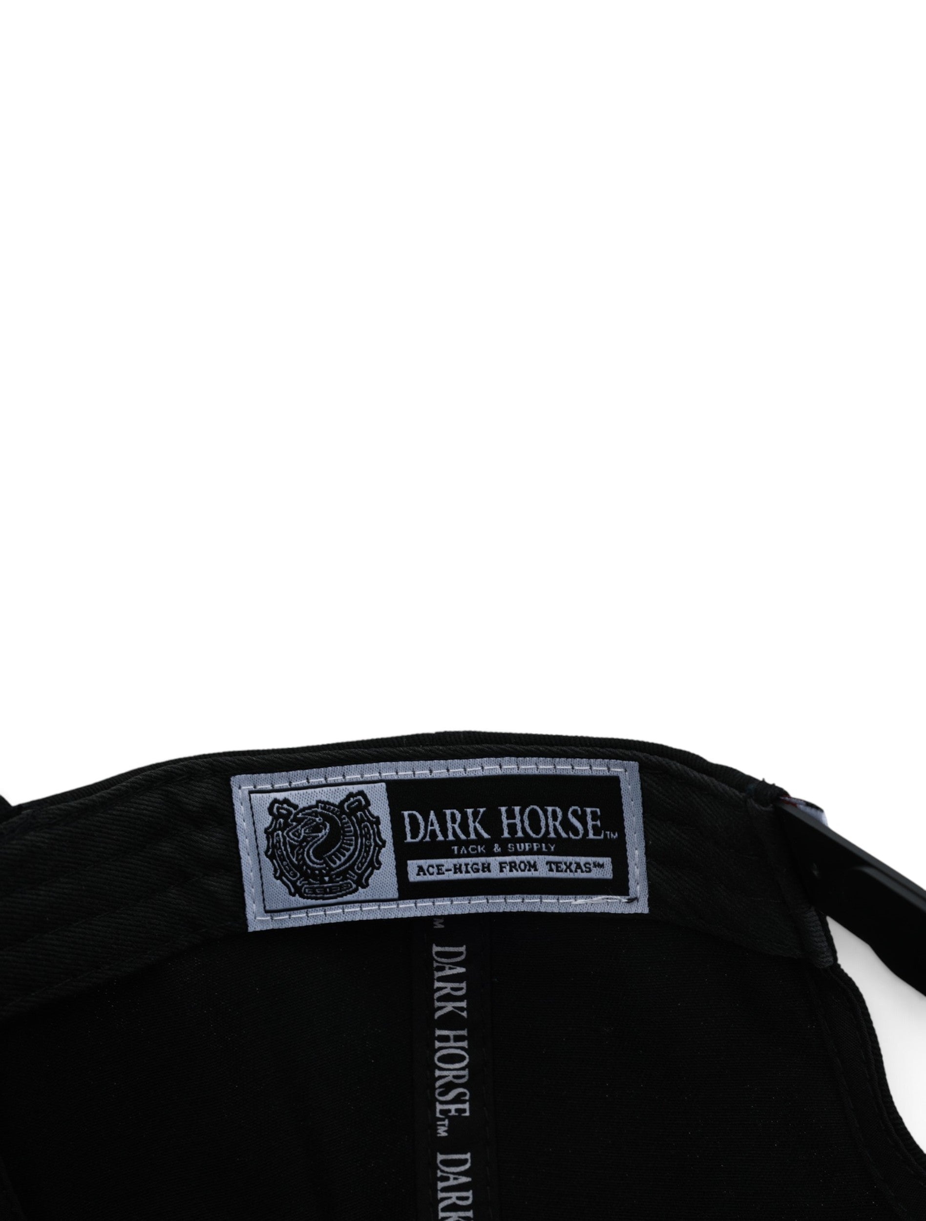 Inside the black Texas Tech cap showing the Dark Horse Tack and Supply label on the sweatband