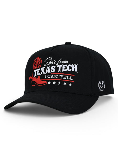 Black Texas Tech snapback cap at an angle, with a red cowboy boot and She's from Texas Tech across the front