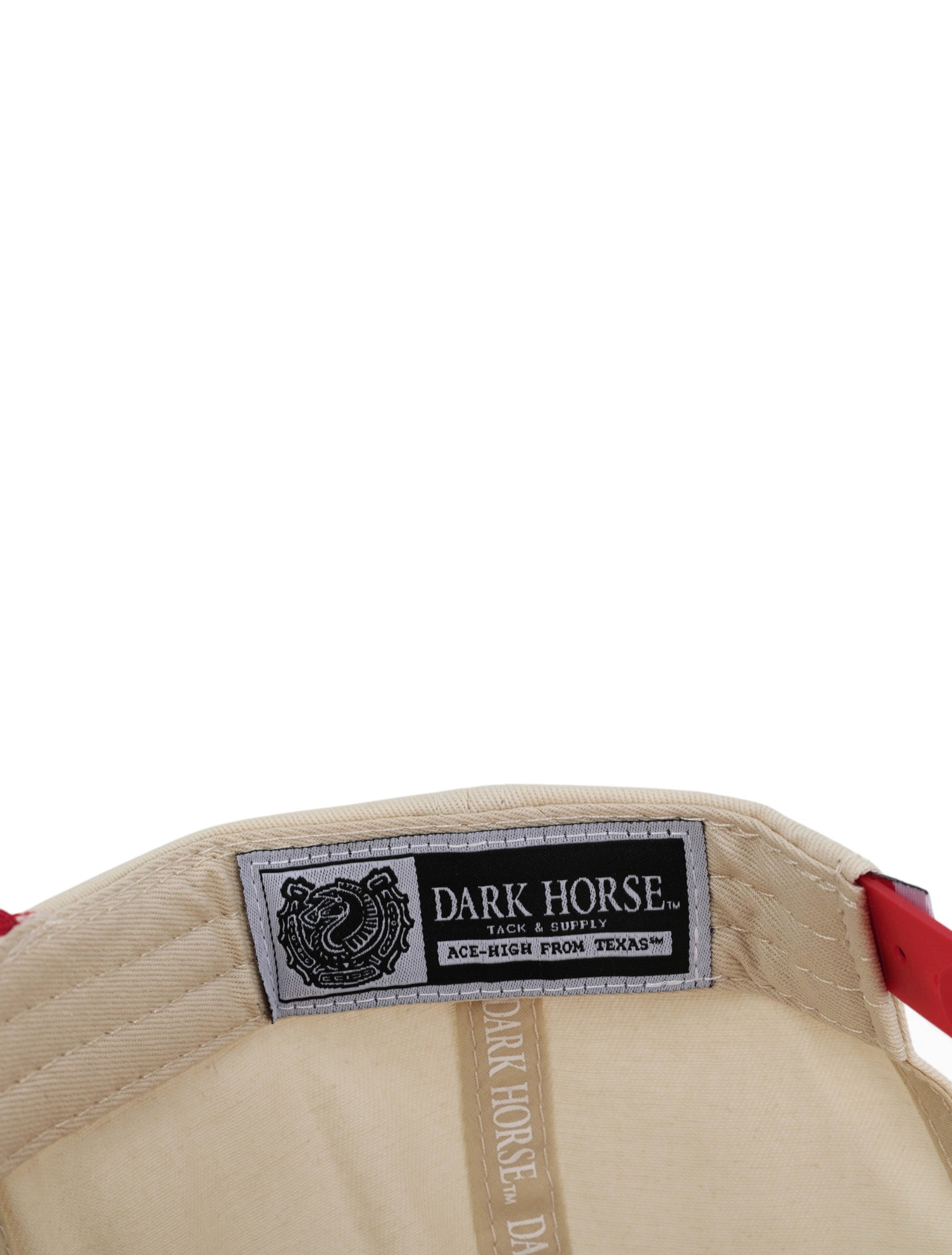 Inside the tan Texas Tech cap showing the Dark Horse Tack and Supply label on the sweatband