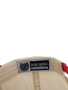 Inside the tan Texas Tech cap showing the Dark Horse Tack and Supply label on the sweatband