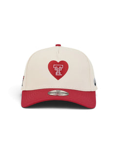 Front of the cream youth Texas Tech cap showing a red heart with the Double T outlined in white inside it