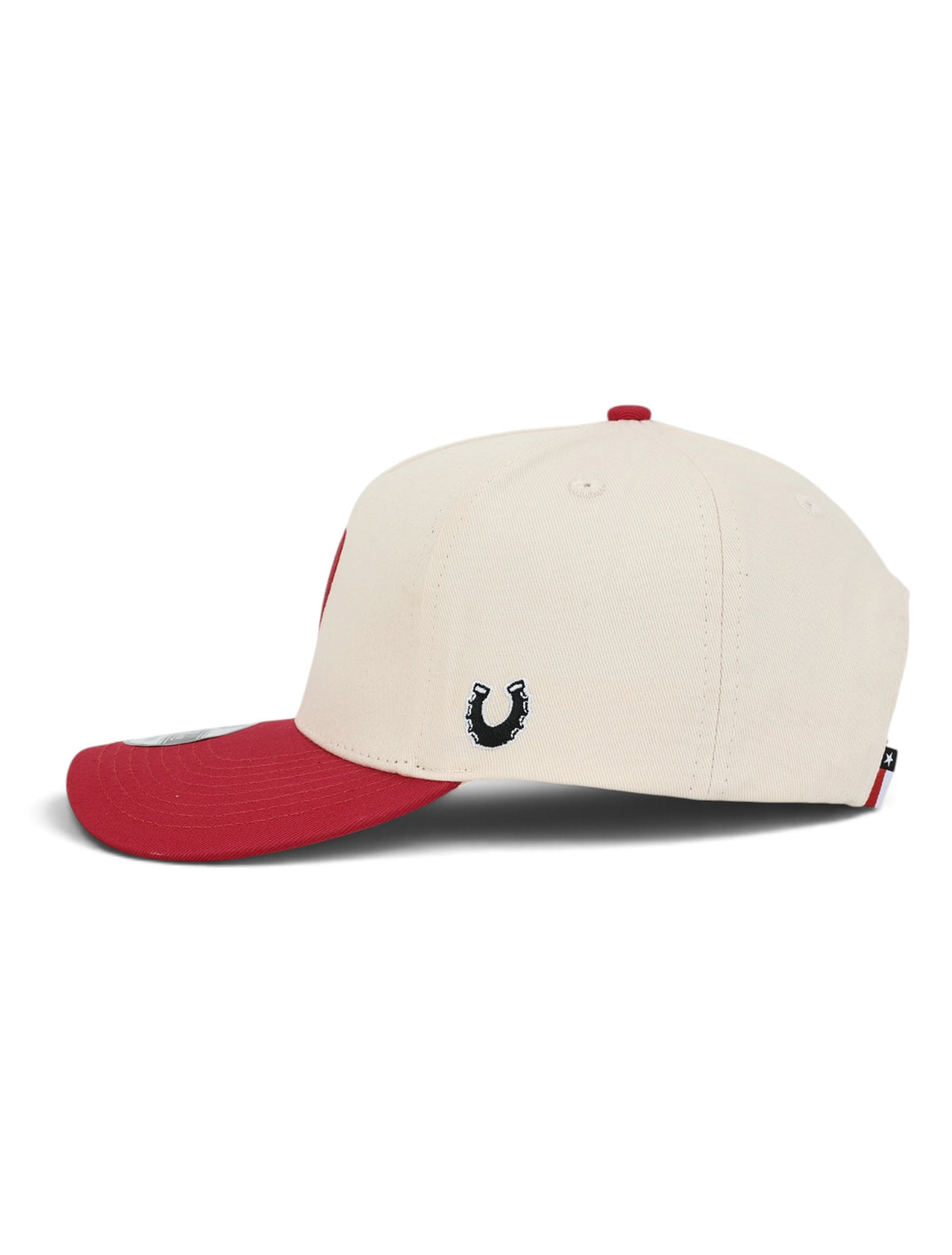 Left side of the cream youth Texas Tech cap showing the Dark Horse horseshoe on the side panel