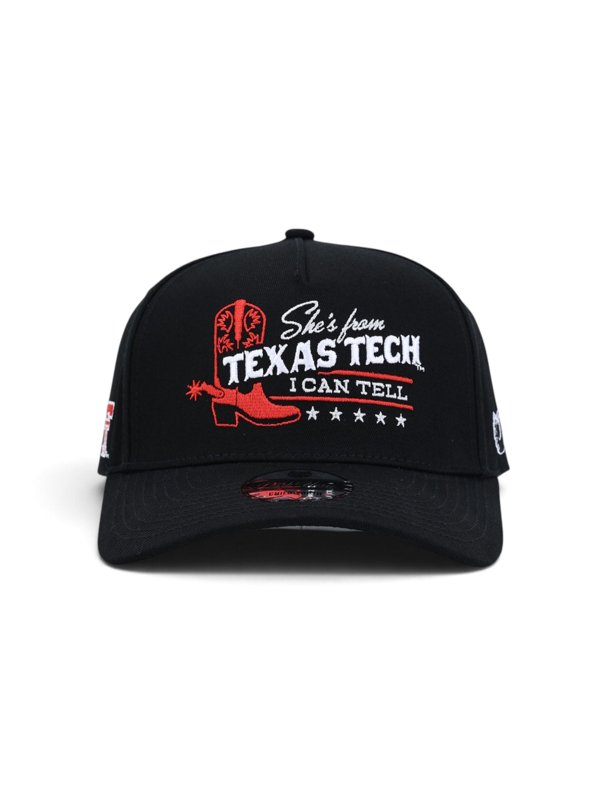 Front of the black youth Texas Tech cap showing a red cowboy boot and spur beside She's from Texas Tech, I Can Tell in white with red rules and five white stars beneath