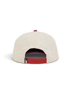 Back of the cream youth Texas Tech cap showing the red snapback strap and the Texas flag tab