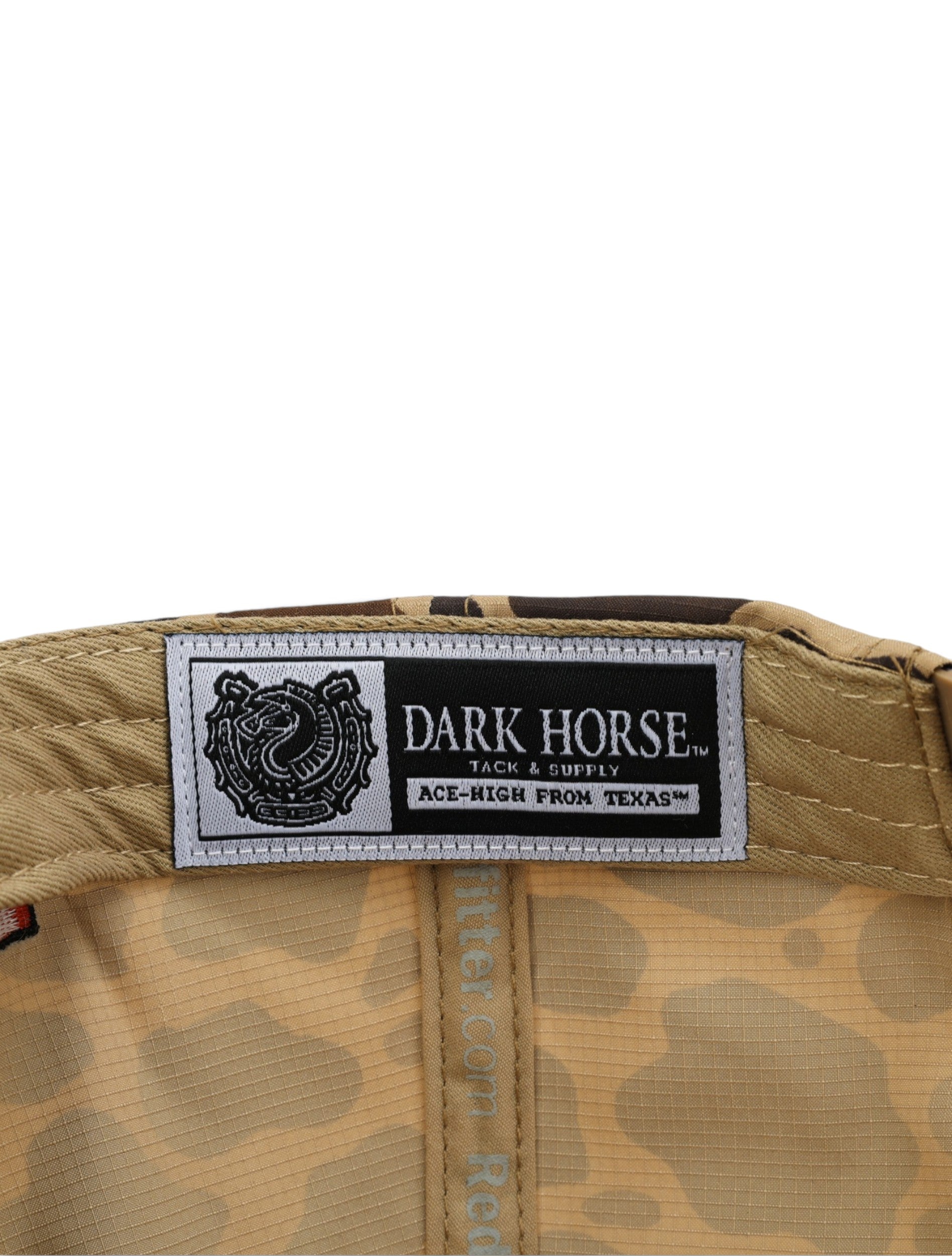 Inside the camo Texas Tech cap showing the Dark Horse Tack and Supply label on the sweatband