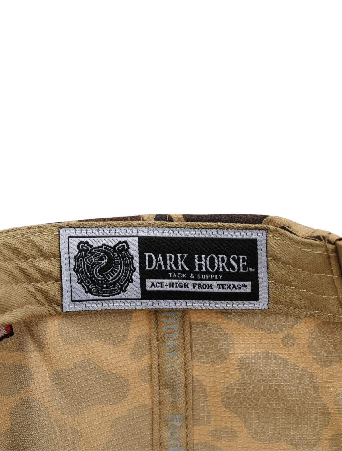 Inside the camo Texas Tech cap showing the Dark Horse Tack and Supply label on the sweatband