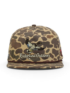 Front of the camo Texas Tech cap showing the mallard over Raiderland Outdoors script above a maroon rope