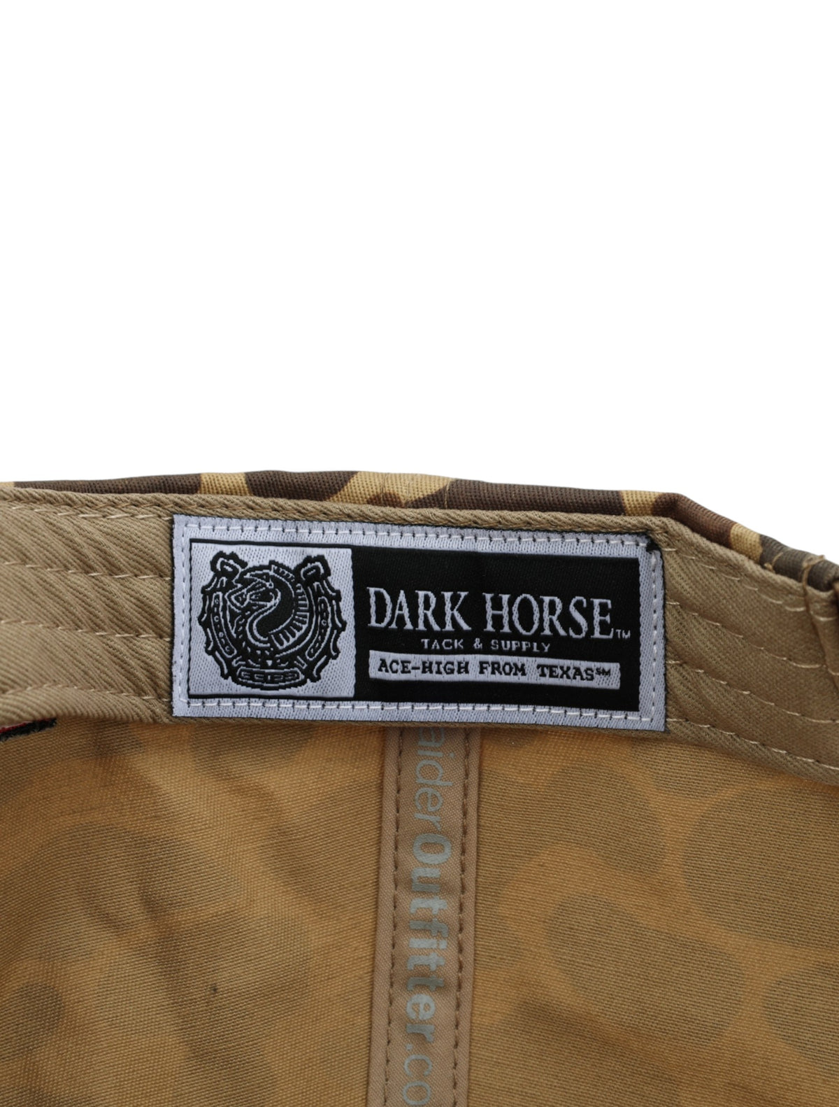 Inside the camo Texas Tech cap showing the Dark Horse Tack and Supply label on the sweatband