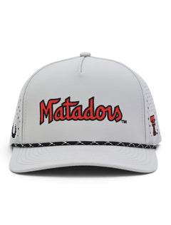 Front of the grey Texas Tech Matadors cap showing the throwback Matadors script above a black and white rope