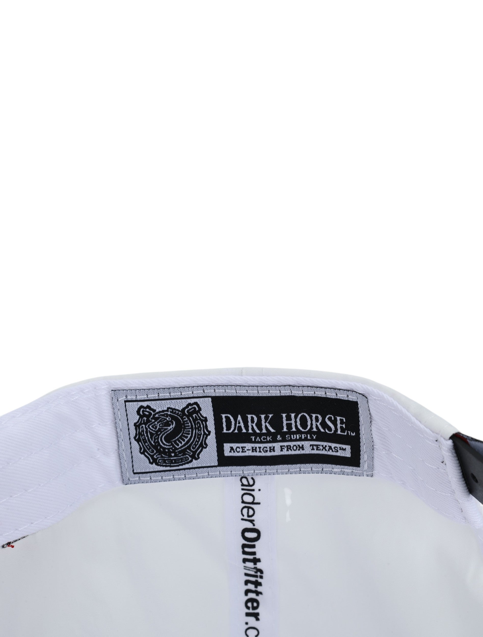 Inside the white Texas Tech cap showing the Dark Horse Tack and Supply label on the sweatband