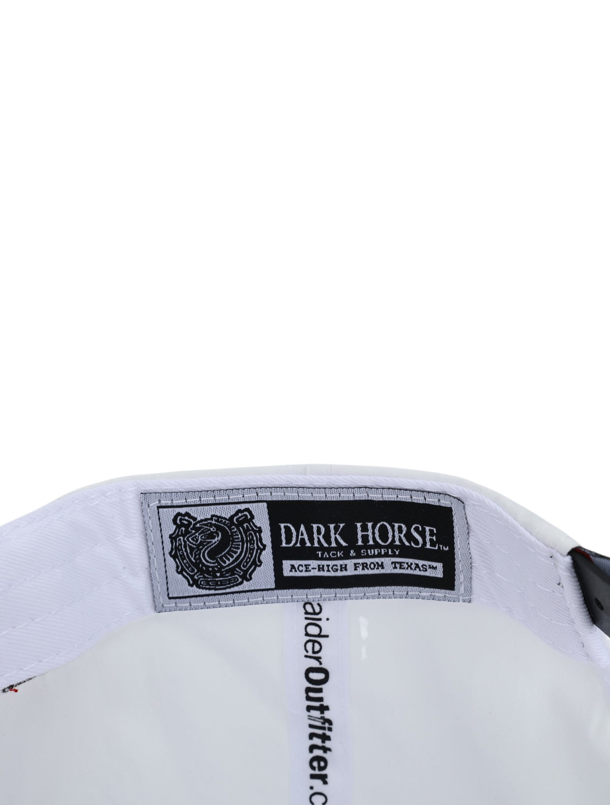 Inside the white Texas Tech cap showing the Dark Horse Tack and Supply label on the sweatband