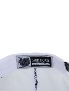 Inside the white Texas Tech cap showing the Dark Horse Tack and Supply label on the sweatband