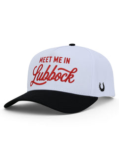 White Texas Tech snapback cap at an angle, with Meet Me In Lubbock in red across the front and a black brim
