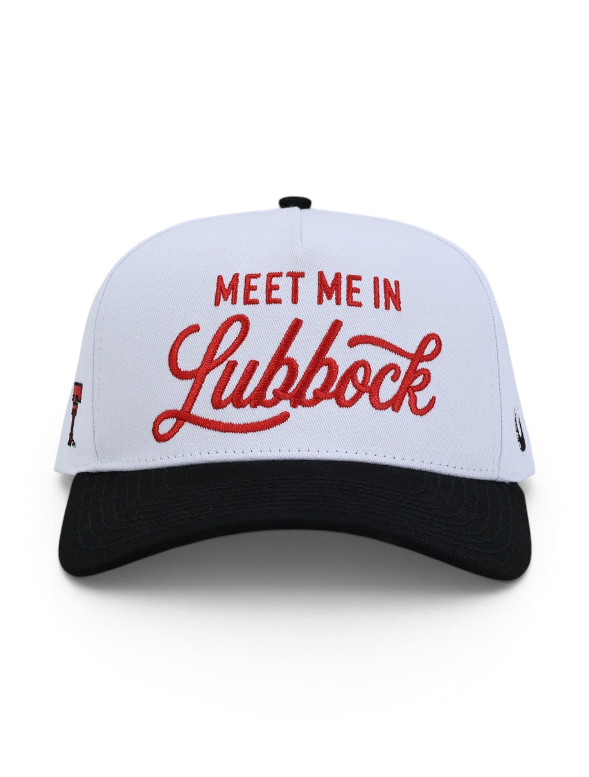 Front of the white Texas Tech cap showing MEET ME IN in red block letters above Lubbock in red script