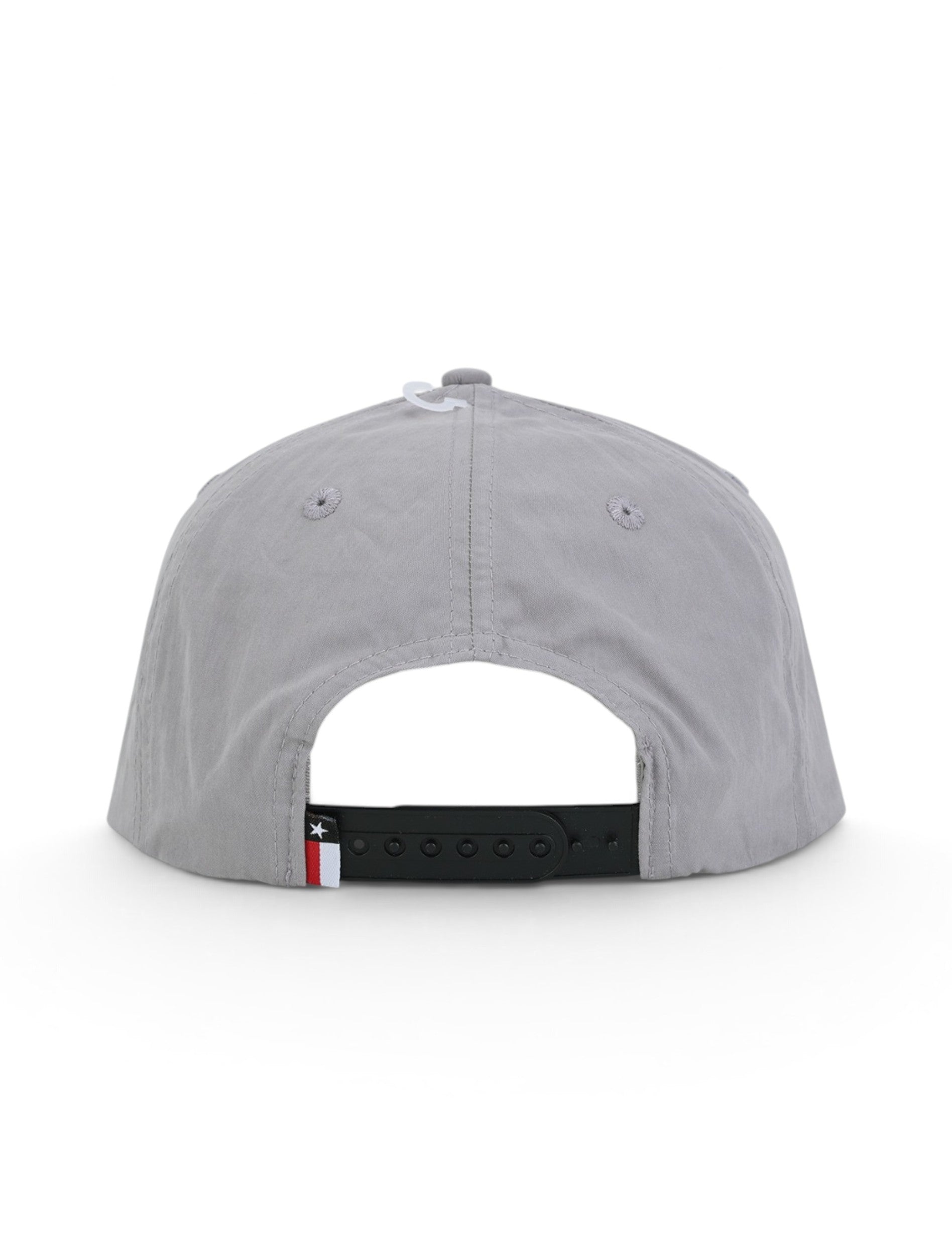 Back of the grey Texas Tech cap showing the stitched eyelets, the black snapback strap and the Texas flag tab