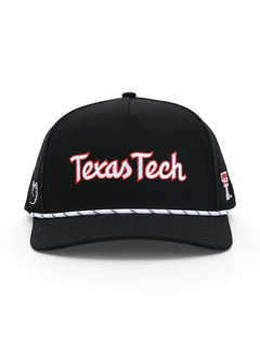 Front of the black Texas Tech cap showing Texas Tech in white script with a red outline above a white and black rope