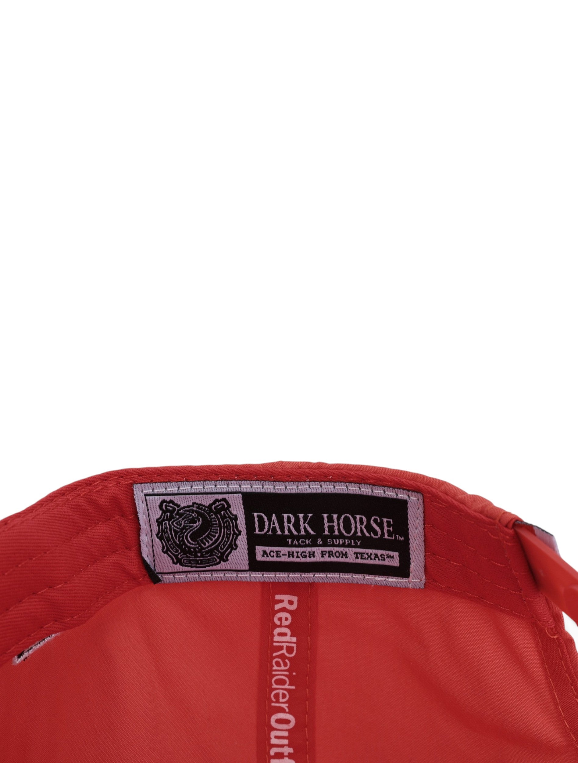 Inside the red Texas Tech cap showing the Dark Horse Tack and Supply label on the sweatband