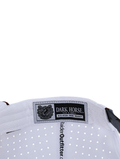 Inside the white Texas Tech cap showing the Dark Horse Tack and Supply label on the sweatband