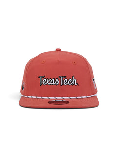 Front of the washed red youth Texas Tech cap showing Texas Tech in white script with a black outline above a white and black rope